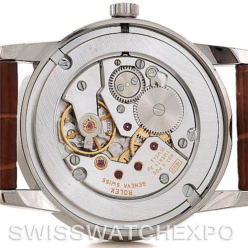 The image shows the back view of the Rolex Cellini 5116 Men's White Gold Silver Dial 5116 Men's White Gold Silver Dial watch, highlighting its intricate mechanical movement.