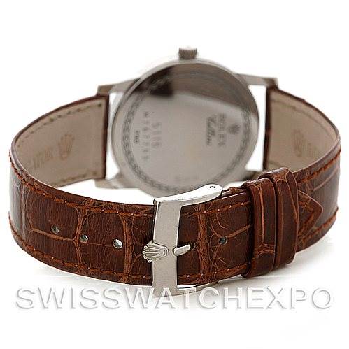 This image shows the back of a Rolex Cellini 5116 Men's White Gold Silver Dial 5116 Men's White Gold Silver Dial watch, focused on the buckle and brown leather strap, with the caseback in the background.