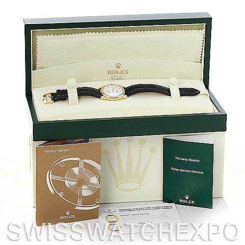 The image shows a Rolex Cellini 4233 Men's Yellow Gold White Dial 4233 Men's Yellow Gold White Dial watch in its open box with accompanying booklets and documentation placed in front.
