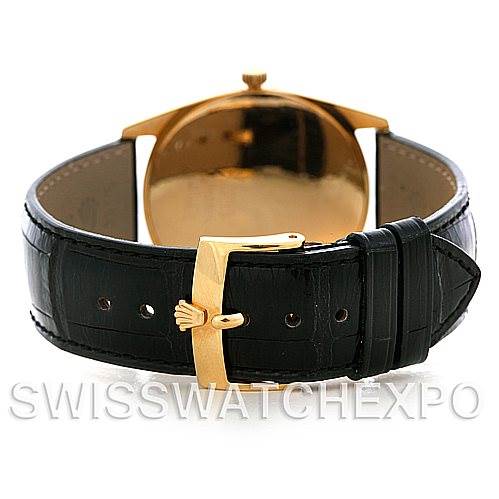 The image shows the back and strap of a Rolex Cellini 4233 Men's Yellow Gold White Dial 4233 Men's Yellow Gold White Dial watch, featuring a black leather strap with a gold buckle.