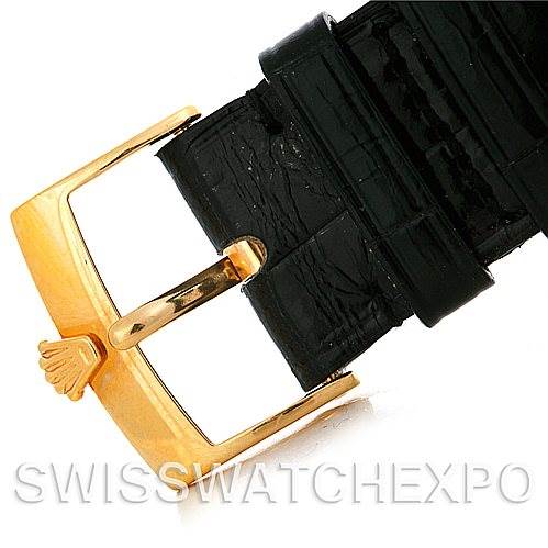 This image shows a close-up of the gold buckle and black leather strap of a Rolex Cellini 4233 Men's Yellow Gold White Dial 4233 Men's Yellow Gold White Dial watch.