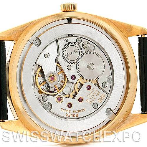 The image shows a close-up view of the movement of a Rolex Cellini 4233 Men's Yellow Gold White Dial 4233 Men's Yellow Gold White Dial watch from the back.