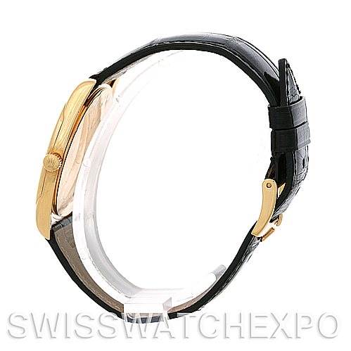 The image shows a side view of a Cellini model by Rolex, highlighting its gold case, crown, and black leather strap.
