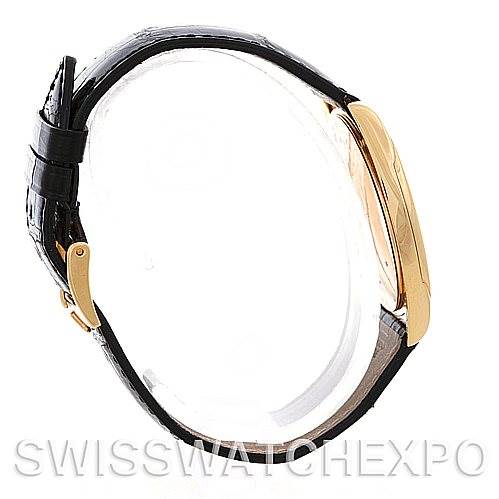 This image shows a Rolex Cellini 4233 Men's Yellow Gold White Dial 4233 Men's Yellow Gold White Dial watch from the side profile, highlighting its case and black leather strap.