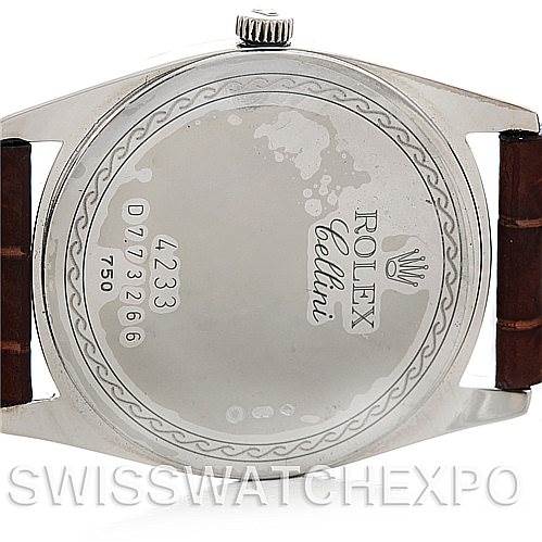 The image shows the back case of a Rolex Cellini 4233 Men's White Gold Black Dial 4233 Men's White Gold Black Dial watch, including the serial number and the brand's logo.