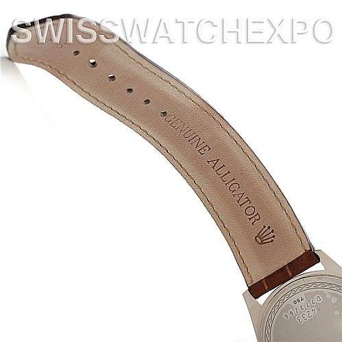 This image shows a partial view of the back of a Rolex Cellini 4233 Men's White Gold Black Dial 4233 Men's White Gold Black Dial watch case and leather strap, indicating it is made of genuine alligator.