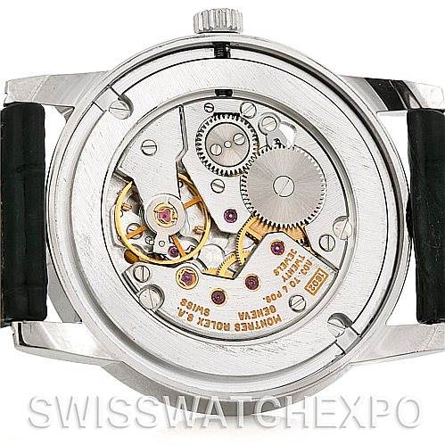 This image shows the back view of a Rolex Cellini 5116 Men's White Gold Black Dial 5116 Men's White Gold Black Dial watch, displaying its intricate mechanical movement and components.