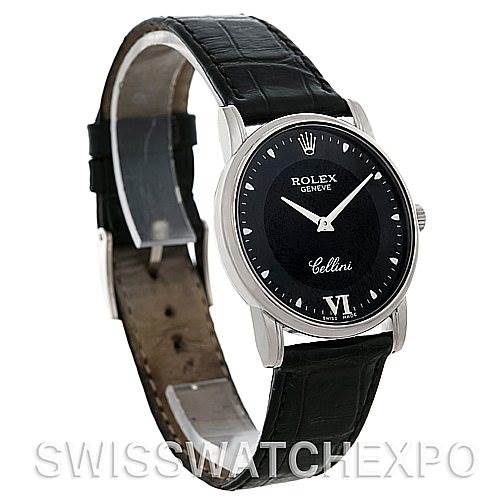 The Rolex Cellini 5116 Men's White Gold Black Dial 5116 Men's White Gold Black Dial watch is shown at an oblique angle highlighting the black dial, Roman numeral VI, and black leather strap.
