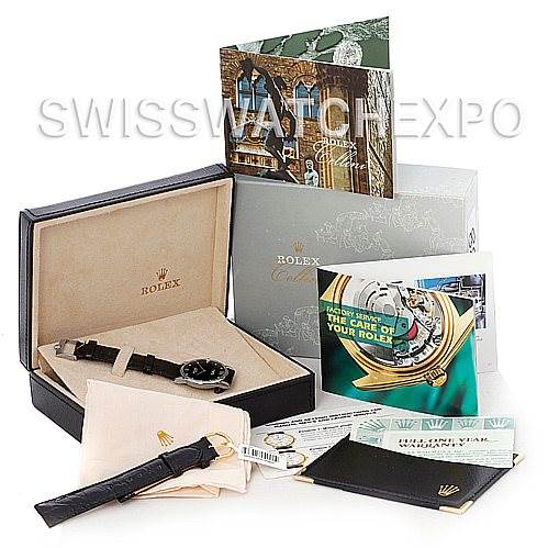 The image shows a Rolex Cellini 5116 Men's White Gold Black Dial 5116 Men's White Gold Black Dial watch with its box and various accessories, including booklets, a leather strap, and a polishing cloth.