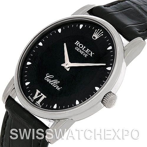 This image shows a close-up, angled view of a Rolex Cellini 5116 Men's White Gold Black Dial 5116 Men's White Gold Black Dial watch, highlighting its black dial, leather strap, and crown.