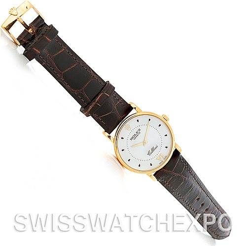 This image shows a Rolex Cellini 5115 Men's Yellow Gold Silver Dial 5115 Men's Yellow Gold Silver Dial watch from a top-down angle, displaying its brown leather strap and gold case.