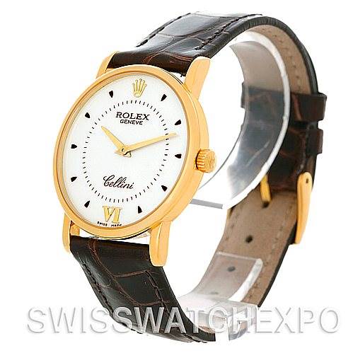 This image shows a side angle view of a Rolex Cellini 5115 Men's Yellow Gold Silver Dial 5115 Men's Yellow Gold Silver Dial watch with a gold case, white dial, and brown leather strap.