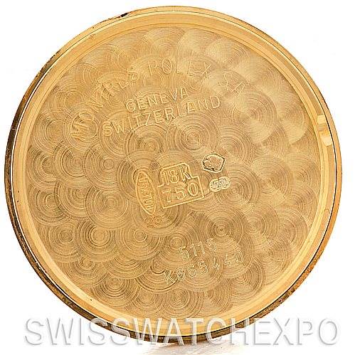 This image shows the inner case back of a Rolex Cellini 5115 Men's Yellow Gold Grey Dial 5115 Men's Yellow Gold Grey Dial watch, featuring engravings denoting the model and gold purity.