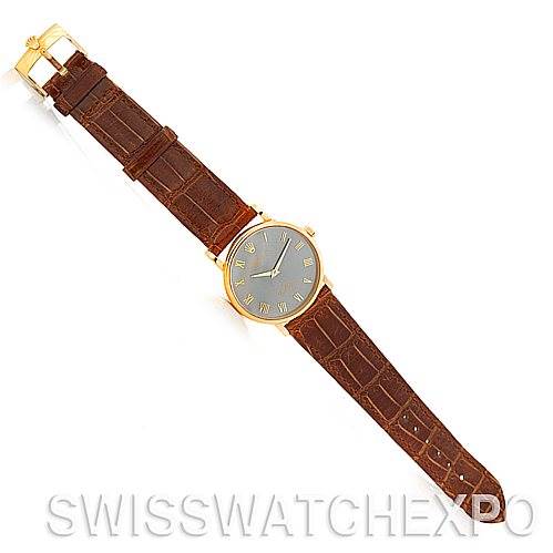 This image shows a top-down view of the Rolex Cellini 5115 Men's Yellow Gold Grey Dial 5115 Men's Yellow Gold Grey Dial watch with a brown leather strap and gold case.