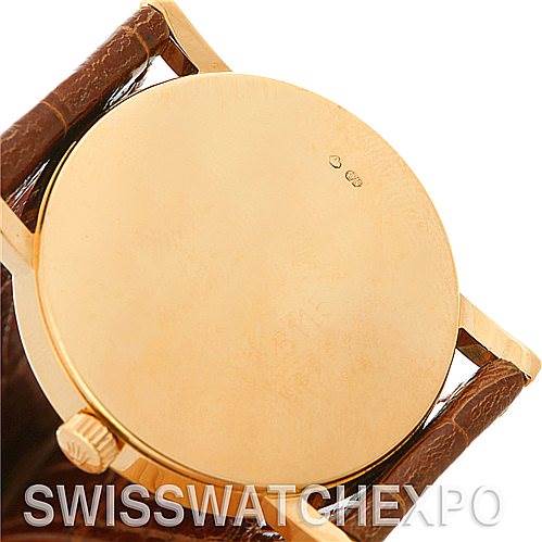 This image shows the back case and crown of a Rolex Cellini 5115 Men's Yellow Gold Grey Dial 5115 Men's Yellow Gold Grey Dial watch from a rear angle.