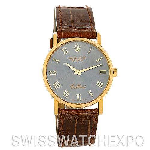 This image shows a frontal view of a Rolex Cellini 5115 Men's Yellow Gold Grey Dial 5115 Men's Yellow Gold Grey Dial watch with a gold case, Roman numeral markers, and a brown leather strap.