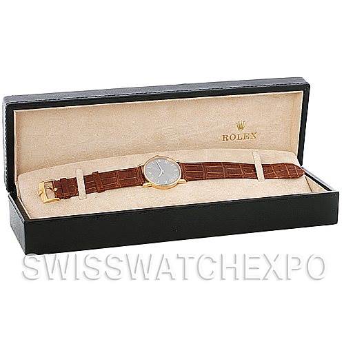 The image shows a Cellini model Rolex watch with a brown leather strap displayed in an open black case.