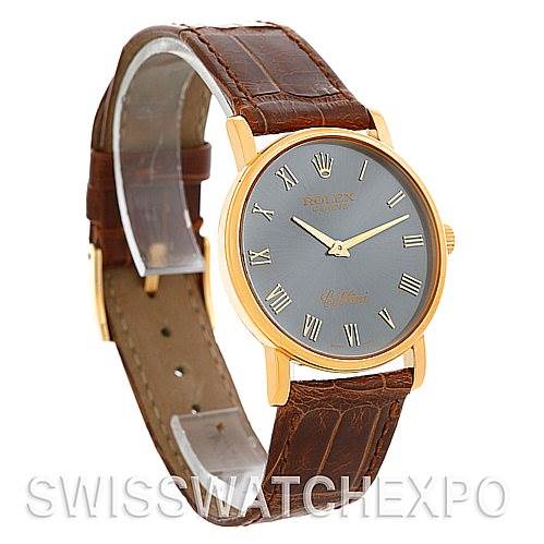 The Rolex Cellini 5115 Men's Yellow Gold Grey Dial 5115 Men's Yellow Gold Grey Dial watch is shown from an angled side view, displaying the face, brown leather strap, and gold case.