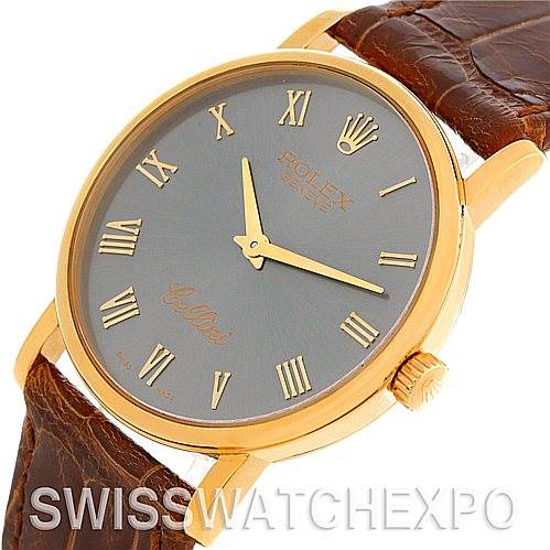 The image shows a close-up angled view of a Rolex Cellini 5115 Men's Yellow Gold Grey Dial 5115 Men's Yellow Gold Grey Dial watch, focusing on the gold case, dial, crown, and brown leather strap.