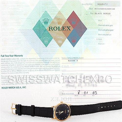 The image shows a Rolex Cellini 5116 Men's Yellow Gold Black Dial 5116 Men's Yellow Gold Black Dial watch laying flat with its strap extended, alongside its warranty card and certificate.