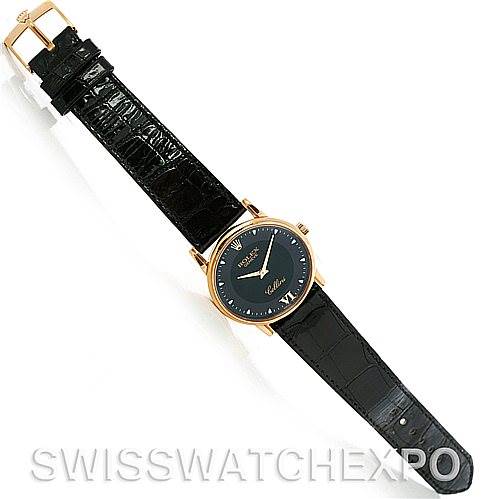 The image shows a top-down view of a Rolex Cellini 5116 Men's Yellow Gold Black Dial 5116 Men's Yellow Gold Black Dial watch, highlighting the watch face, black leather strap, and gold buckle.