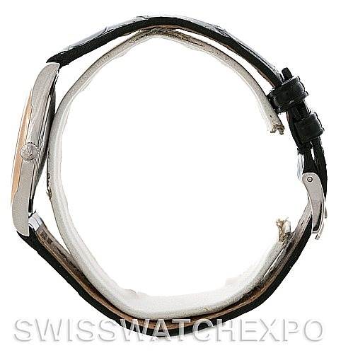 The image shows the side view of a Rolex Cellini 4233 Men
s White Gold Black Dial 4233 Men
s White Gold Black Dial watch, highlighting its case, crown, and leather strap with a buckle.