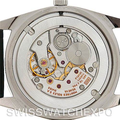 The image shows the back view of a Rolex Cellini 4233 Men
s White Gold Black Dial 4233 Men
s White Gold Black Dial watch, revealing its internal mechanical movement.
