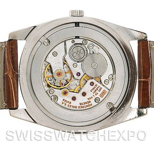 This image shows the rear view of a Rolex Cellini 4233 Men's White Gold Black Dial 4233 Men's White Gold Black Dial watch, highlighting its internal mechanical movement.