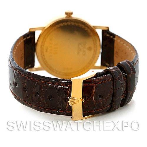 The image shows the back view of a Rolex Cellini 5115 Men's Yellow Gold Beige Dial 5115 Men's Yellow Gold Beige Dial watch, highlighting its leather strap and gold clasp.