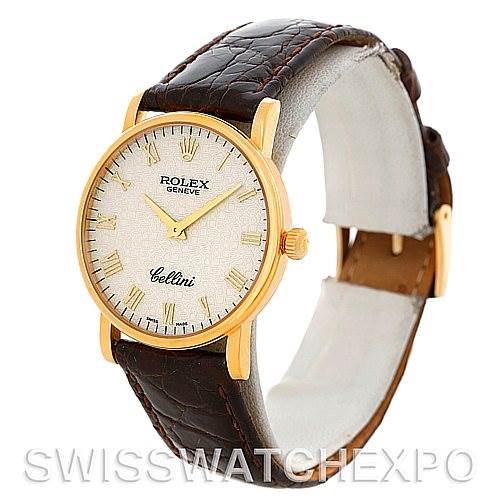 The Rolex Cellini 5115 Men's Yellow Gold Beige Dial 5115 Men's Yellow Gold Beige Dial watch is shown at a three-quarter angle, highlighting its face, casing, and leather strap.