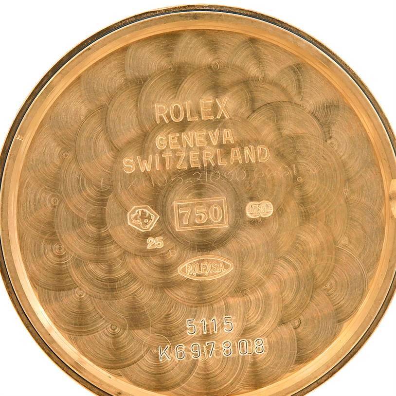 This image shows the inside case back of a Rolex Cellini 5115 Men's Yellow Gold Silver Dial 5115 Men's Yellow Gold Silver Dial, featuring engravings and hallmarks.