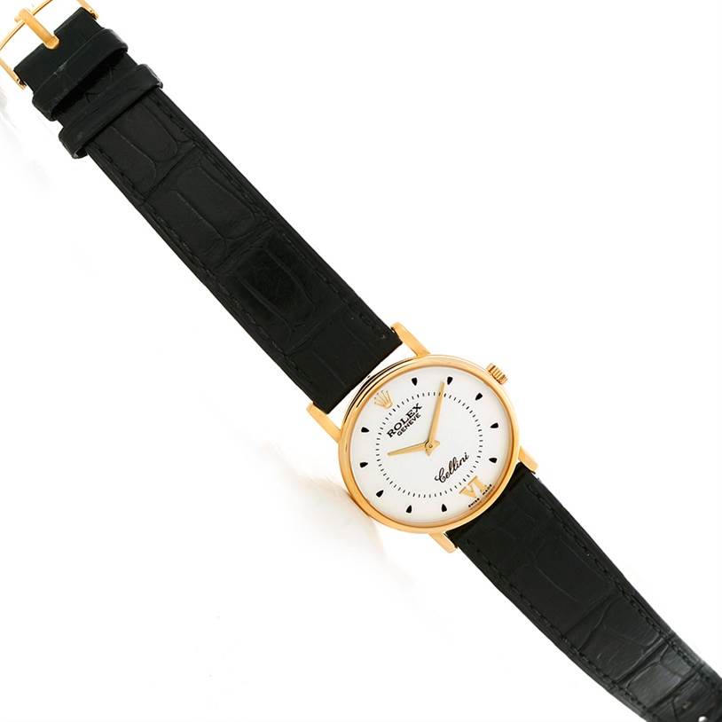 The Rolex Cellini 5115 Men's Yellow Gold Silver Dial 5115 Men's Yellow Gold Silver Dial watch is displayed flat, showing its white dial, gold case, black leather strap, and buckle.