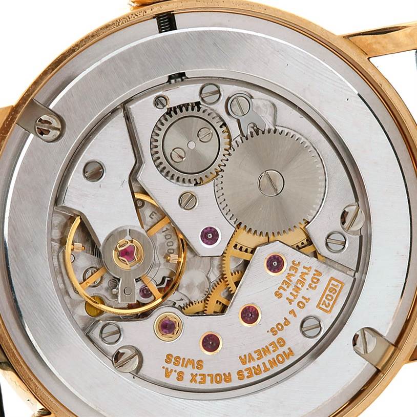 This image shows a close-up view of the movement mechanism of a Rolex Cellini 5115 Men's Yellow Gold Silver Dial 5115 Men's Yellow Gold Silver Dial watch.
