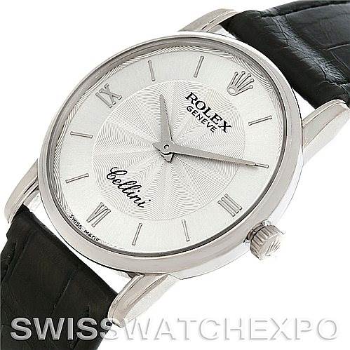 The Rolex Cellini 5116 Men's White Gold Silver Dial 5116 Men's White Gold Silver Dial watch is shown at an angle, featuring the dial, case, and part of the black leather strap.