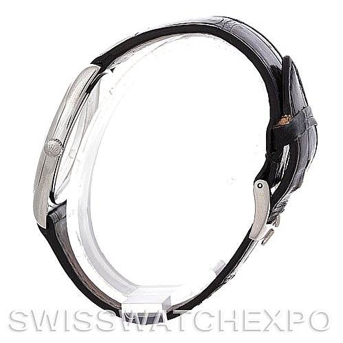 The image shows a side view of a Rolex Cellini 4233 Men's White Gold White Dial 4233 Men's White Gold White Dial watch, highlighting the case, crown, and leather strap with a clasp.