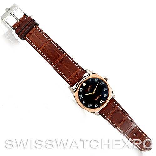 The Rolex Cellini 4233 Men's White Gold Black Dial 4233 Men's White Gold Black Dial watch is shown from a top view, displaying its brown leather strap, black dial, and silver buckle.