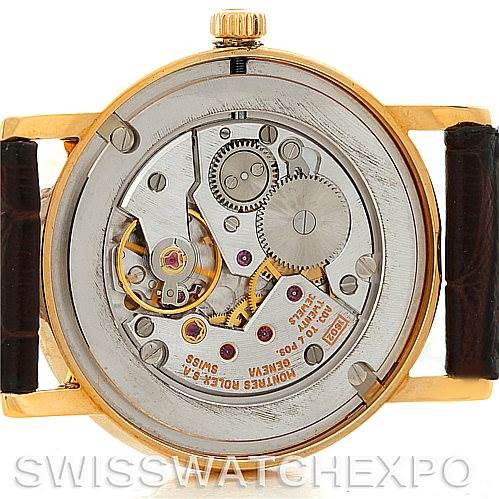 This is a rear view of a Rolex Cellini 5115 Men's Yellow Gold Black Dial 5115 Men's Yellow Gold Black Dial watch, showing the inner mechanical movement and parts.