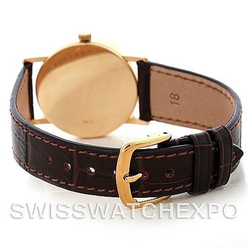 The image shows the rear view of a Rolex Cellini 5115 Men's Yellow Gold Black Dial 5115 Men's Yellow Gold Black Dial watch, highlighting the leather strap and gold buckle.