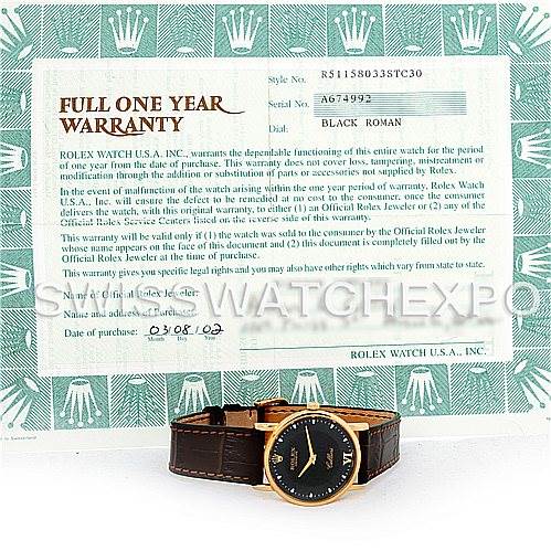 The image shows a Rolex Cellini 5115 Men's Yellow Gold Black Dial 5115 Men's Yellow Gold Black Dial watch resting on a Rolex warranty card viewed from above.