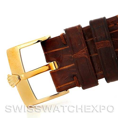 The image shows a close-up view of the gold buckle and brown leather strap of a Rolex Cellini 5116 Men
s Yellow Gold Beige Dial 5116 Men
s Yellow Gold Beige Dial watch.