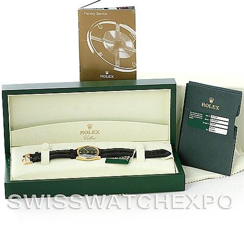 This image shows a Rolex Cellini 4233 Men's Yellow Gold Black Dial 4233 Men's Yellow Gold Black Dial watch in its box with accompanying paperwork from a front angle.