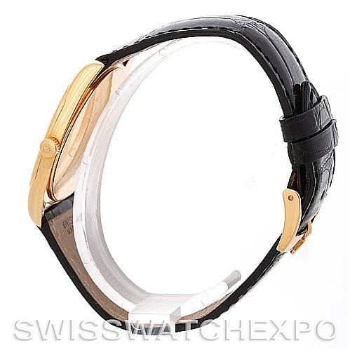 This image shows a side profile of a Rolex Cellini 4233 Men's Yellow Gold Black Dial 4233 Men's Yellow Gold Black Dial watch, highlighting its crown, case, and black leather strap.