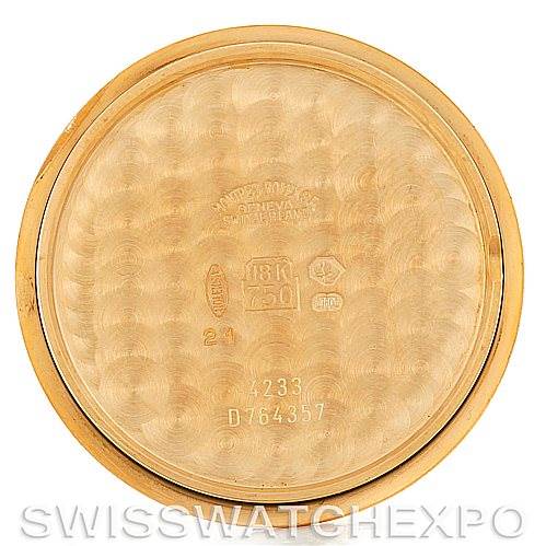 This is the inside view of the case back of a Rolex Cellini 4233 Men's Yellow Gold Black Dial 4233 Men's Yellow Gold Black Dial watch, showing its engravings and hallmarks.