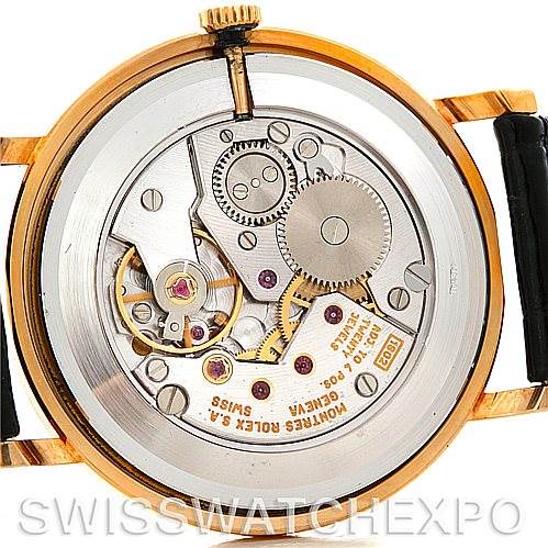 This image shows the internal mechanics and movement of the Rolex Cellini 5112 Men's Yellow Gold White Dial 5112 Men's Yellow Gold White Dial watch, viewed from the back case.