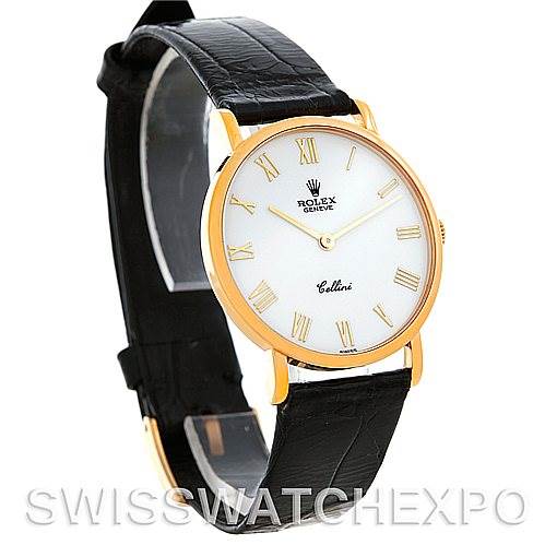 The Rolex Cellini 5112 Men's Yellow Gold White Dial 5112 Men's Yellow Gold White Dial watch is shown at a slight angle, displaying its round dial, gold case, black leather strap, and Roman numeral markers.