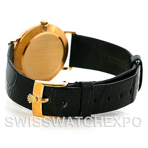 The image shows the back view of a Rolex Cellini 5112 Men's Yellow Gold White Dial 5112 Men's Yellow Gold White Dial watch, highlighting its black leather strap and gold buckle.