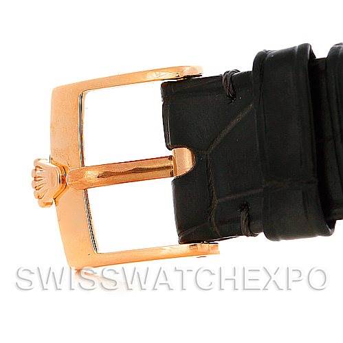 This image shows the buckle and part of the black leather strap of a Rolex Cellini 5320/5 Rose Gold Grey Dial 5320/5 Rose Gold Grey Dial watch.