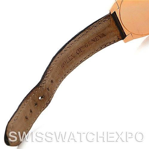 The image shows a close-up angle of the leather strap and part of the case of a Rolex Cellini 5320/5 Rose Gold Grey Dial 5320/5 Rose Gold Grey Dial watch.