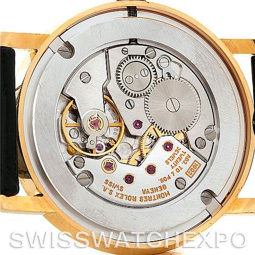 This image shows the back of a Rolex Cellini 5115 Men's Yellow Gold Black Dial 5115 Men's Yellow Gold Black Dial watch, highlighting its intricate mechanical movement.