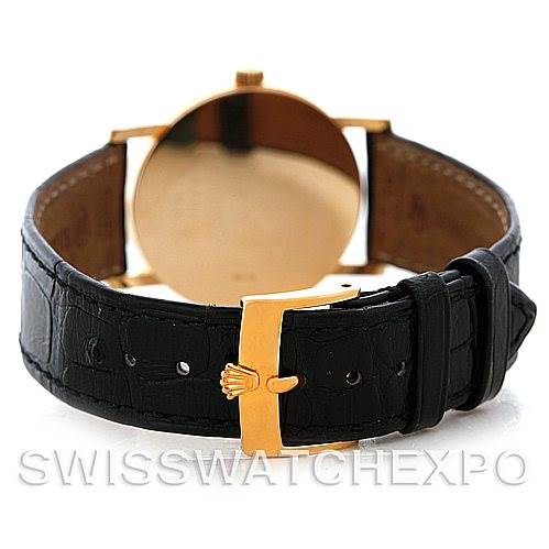The image shows the back view of a Rolex Cellini 5115 Men's Yellow Gold Black Dial 5115 Men's Yellow Gold Black Dial watch displaying its black leather strap and gold buckle.